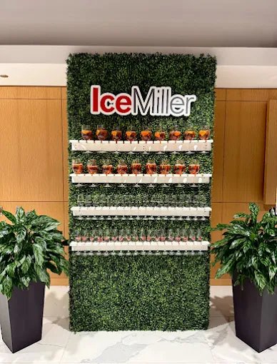 Hedge wall drink station rental Chicago corporate event branded backdrop with shelves