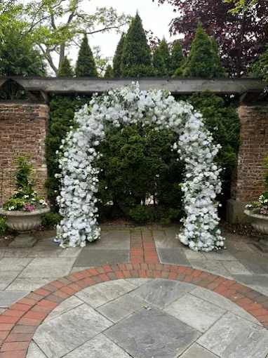 All white rose greenery garden floral arch rental Chicago