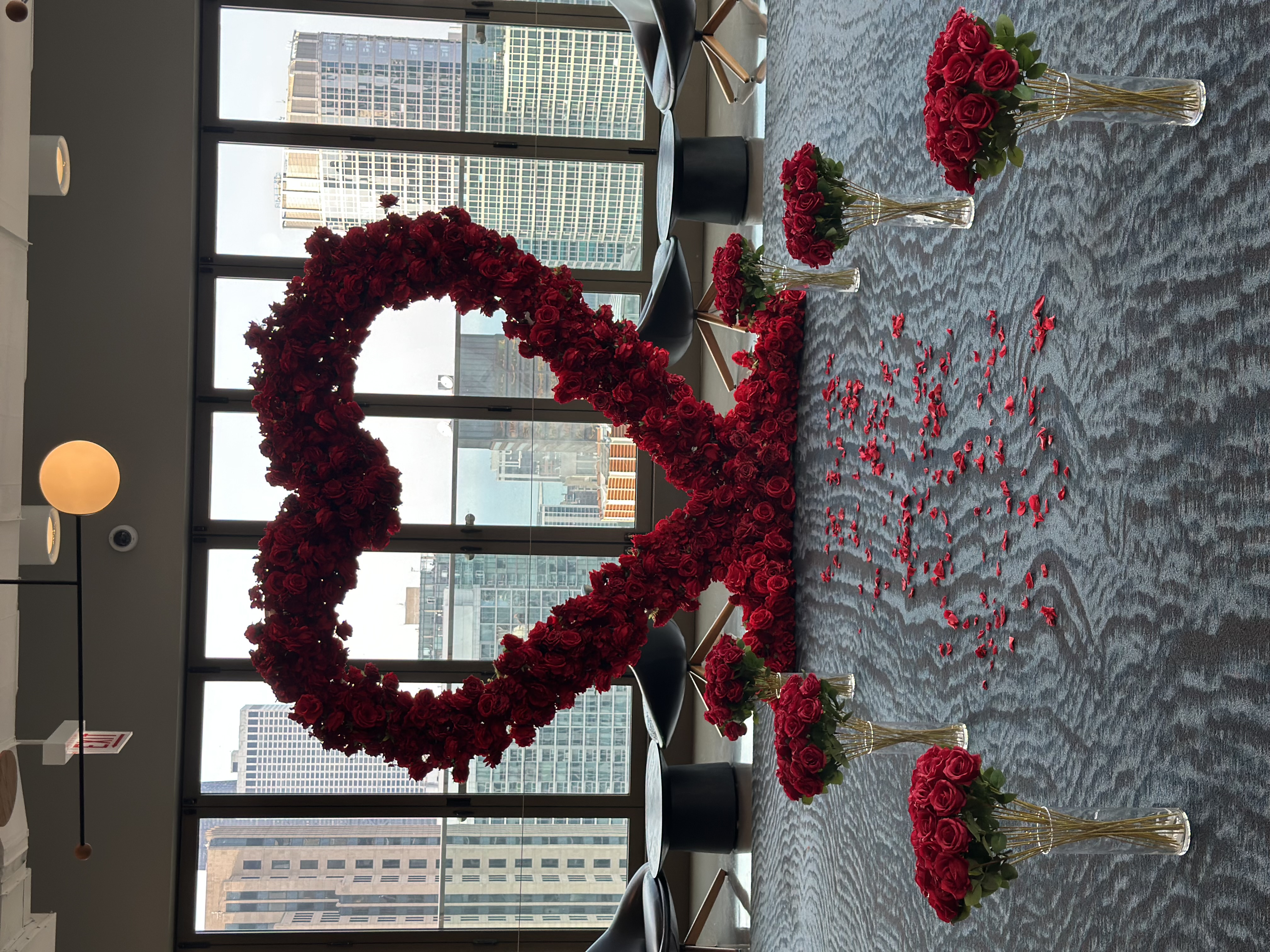 Proposal arrangement near me — tall floral vase arrangements framing a romantic Chicago proposal