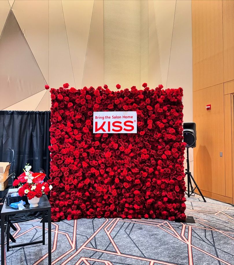 Red rose flower wall rental Chicago — bold red rose backdrop for wedding reception photo opportunity