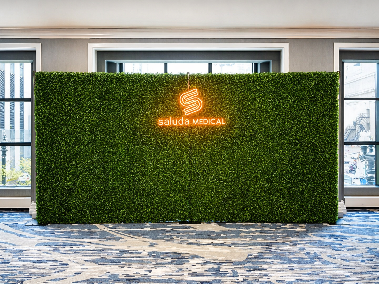 Boxwood hedge wall rental in Chicago — greenery backdrop at a hotel ballroom event