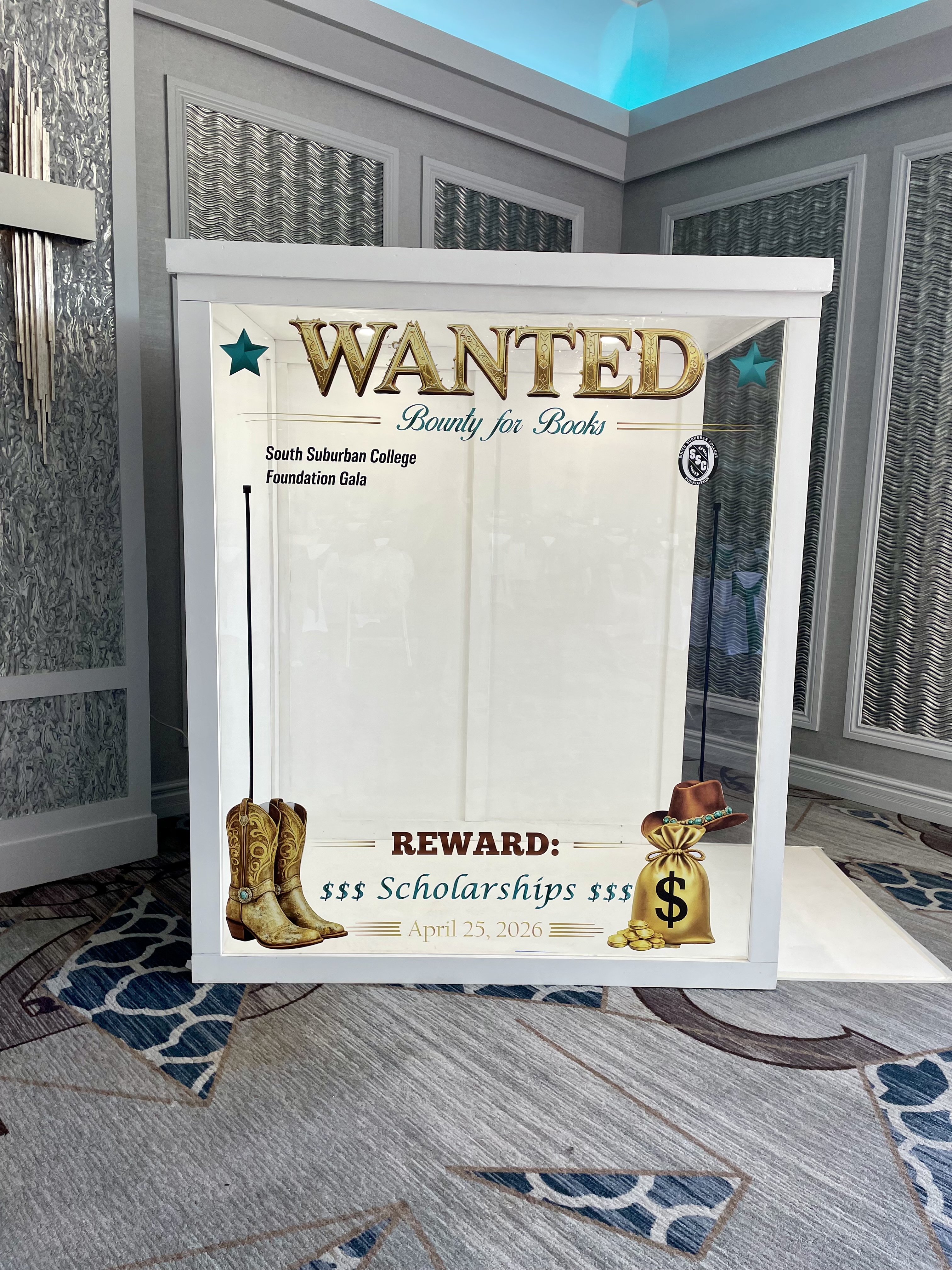 Corporate event photo booth rental Chicago — custom branded gala panel with western themed design for foundation fundraiser