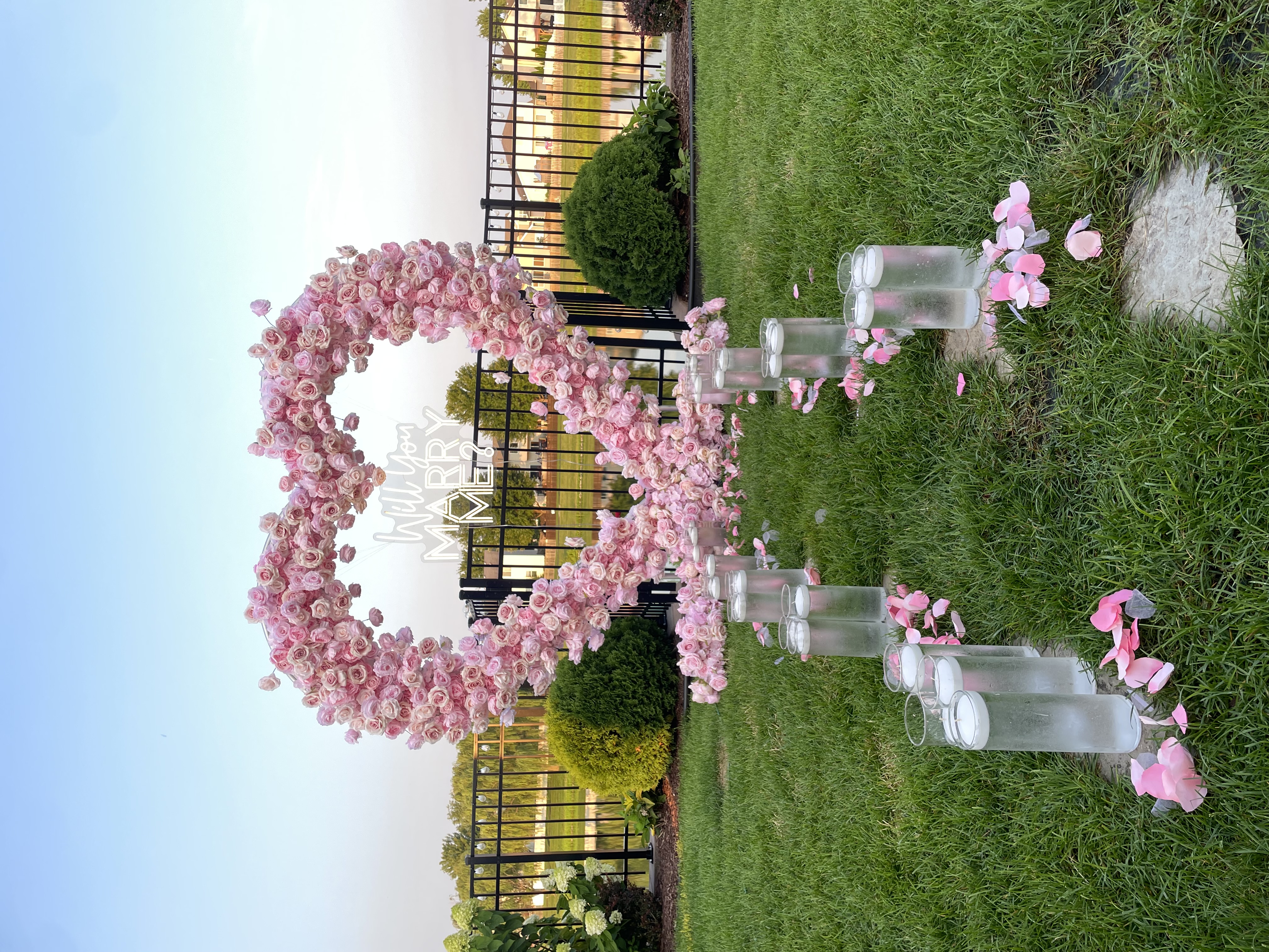 Luxury proposal experience Chicago — surprise proposal setup with heart arch and red carpet in Chicago