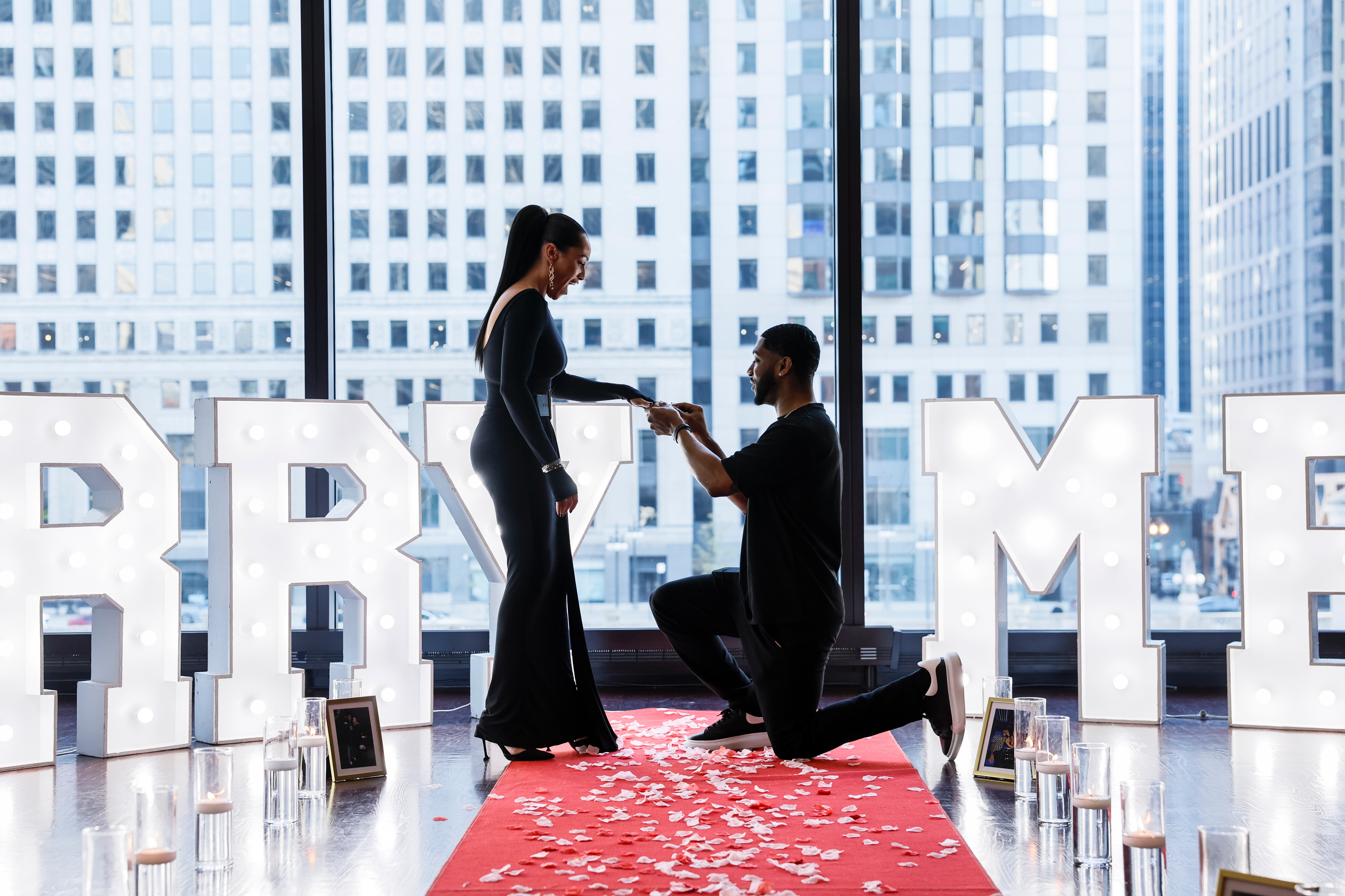 Hotel proposal packages Chicago — elegant indoor proposal at Chicago hotel with heart arch and candles