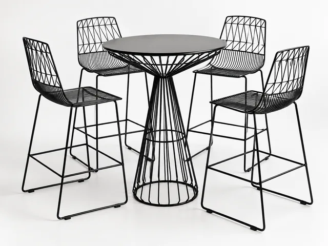 Black wire-frame cocktail table with matching stools, studio product photo