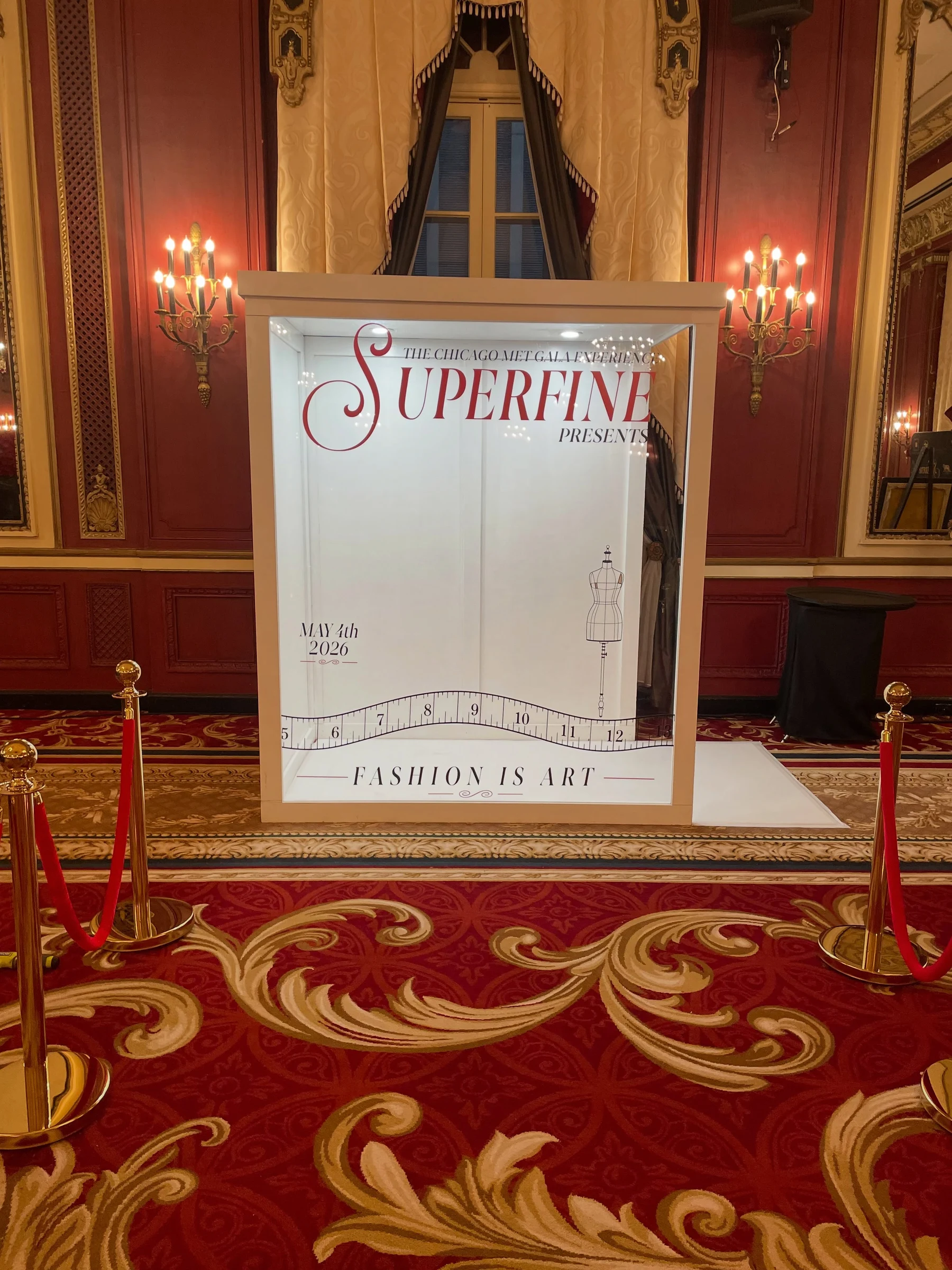 Magazine photo booth rental in Chicago with a Superfine Chicago Met Gala Experience cover, May 4th 2026, in a red and gold ballroom.