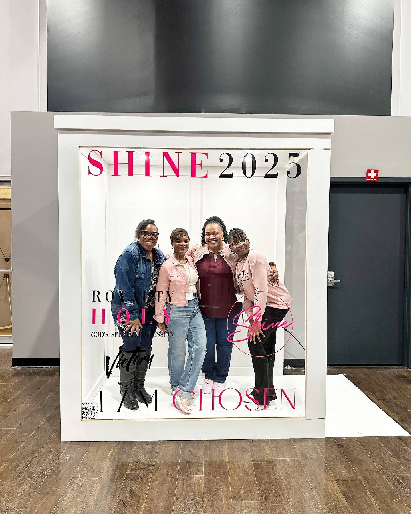 Magazine photo booth rental in Chicago — white magazine cover photo booth printed SHINE 2025 for Victory Cathedral, with four women posing inside the box at a church conference