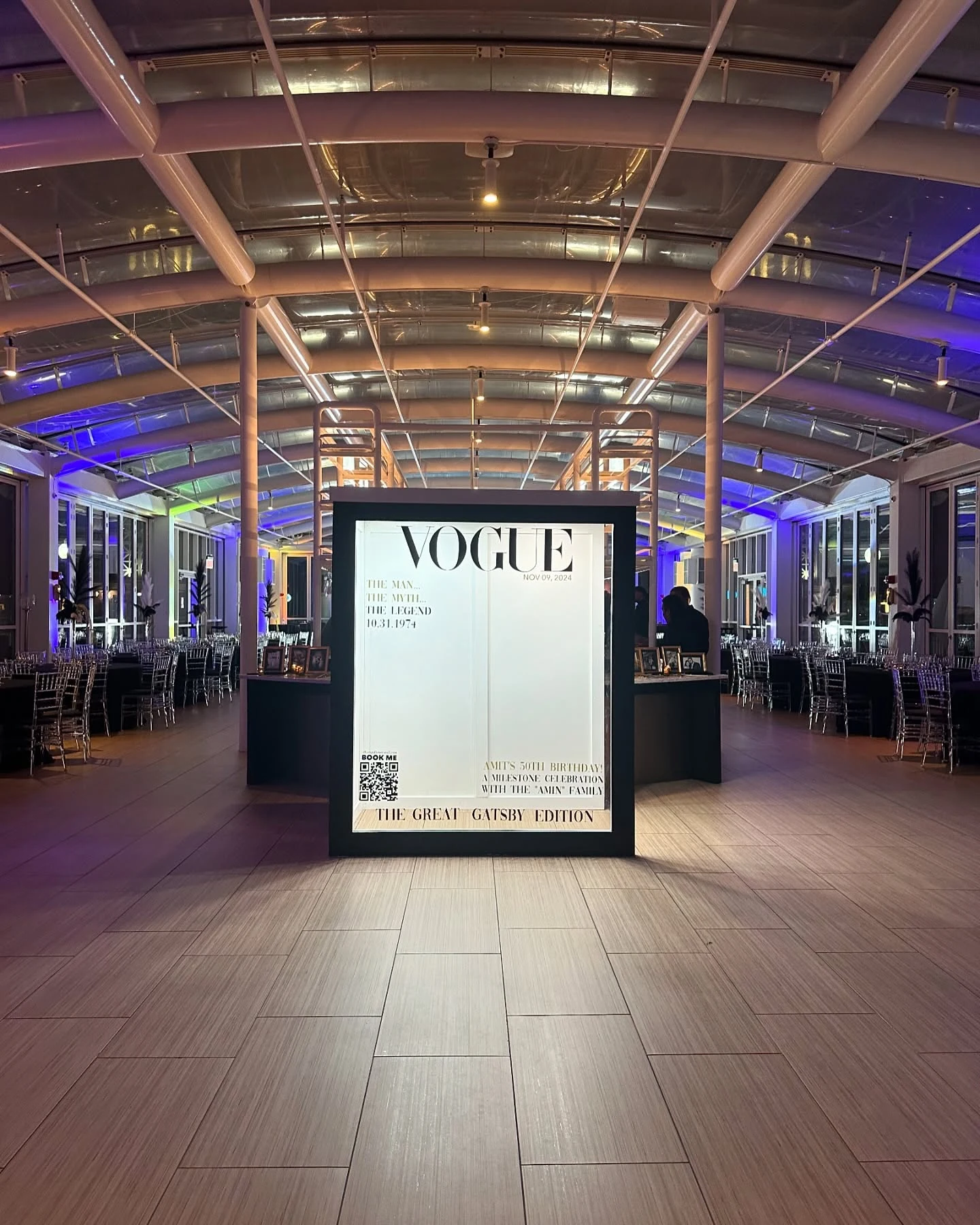 Magazine photo booth rental in Chicago — Vogue-inspired magazine cover photo booth printed as The Great Gatsby Edition for a 50th birthday in a glass-arched hall at Navy Pier